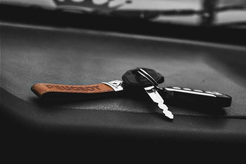 Car keys sitting in a car seat: four of the best car theft prevention tools