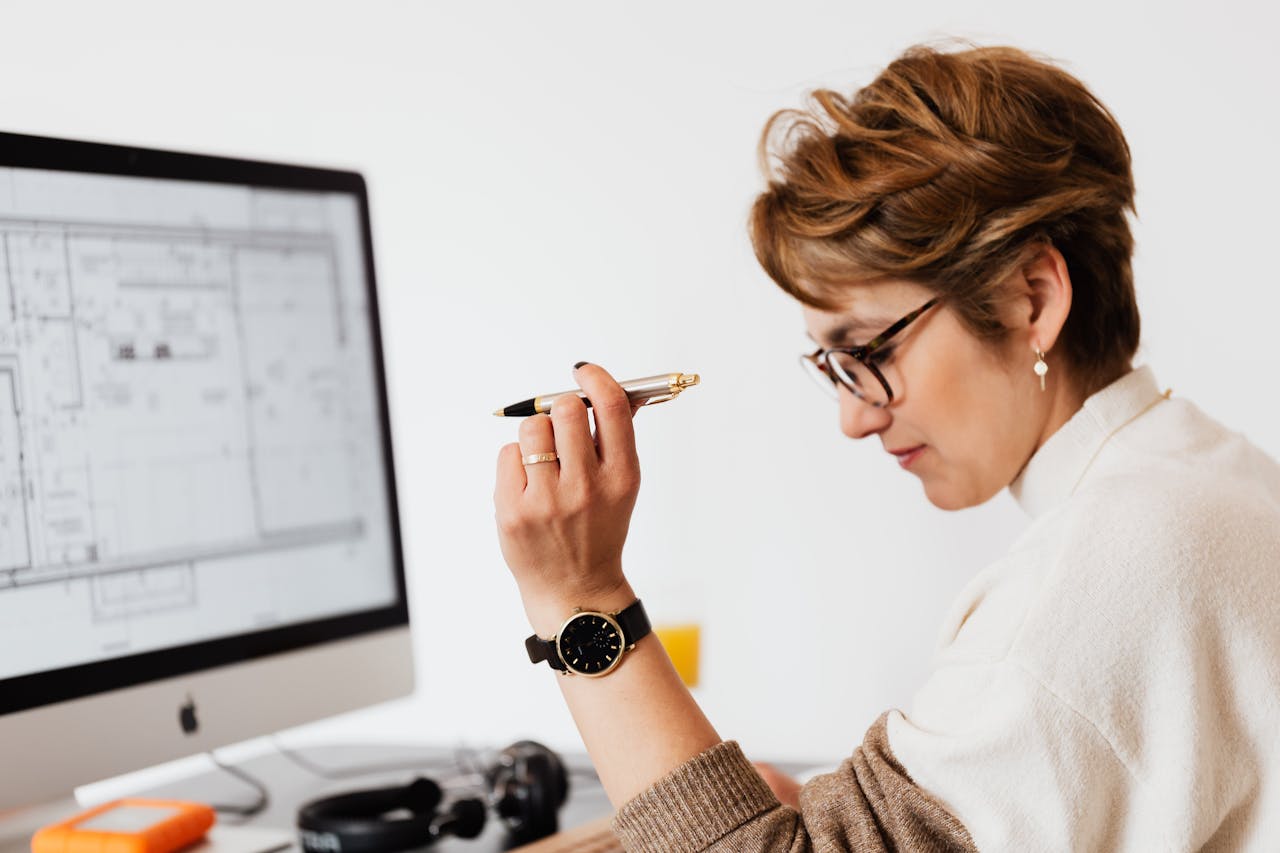 woman making design decision: Prefab vs. Custom Metal Buildings